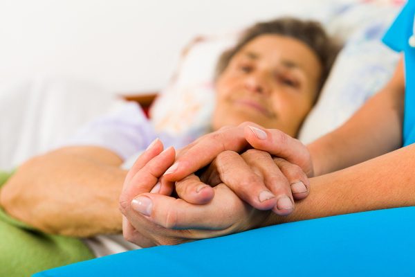 Caring Nurse Holding Hands Caring Nurse Holding Hands